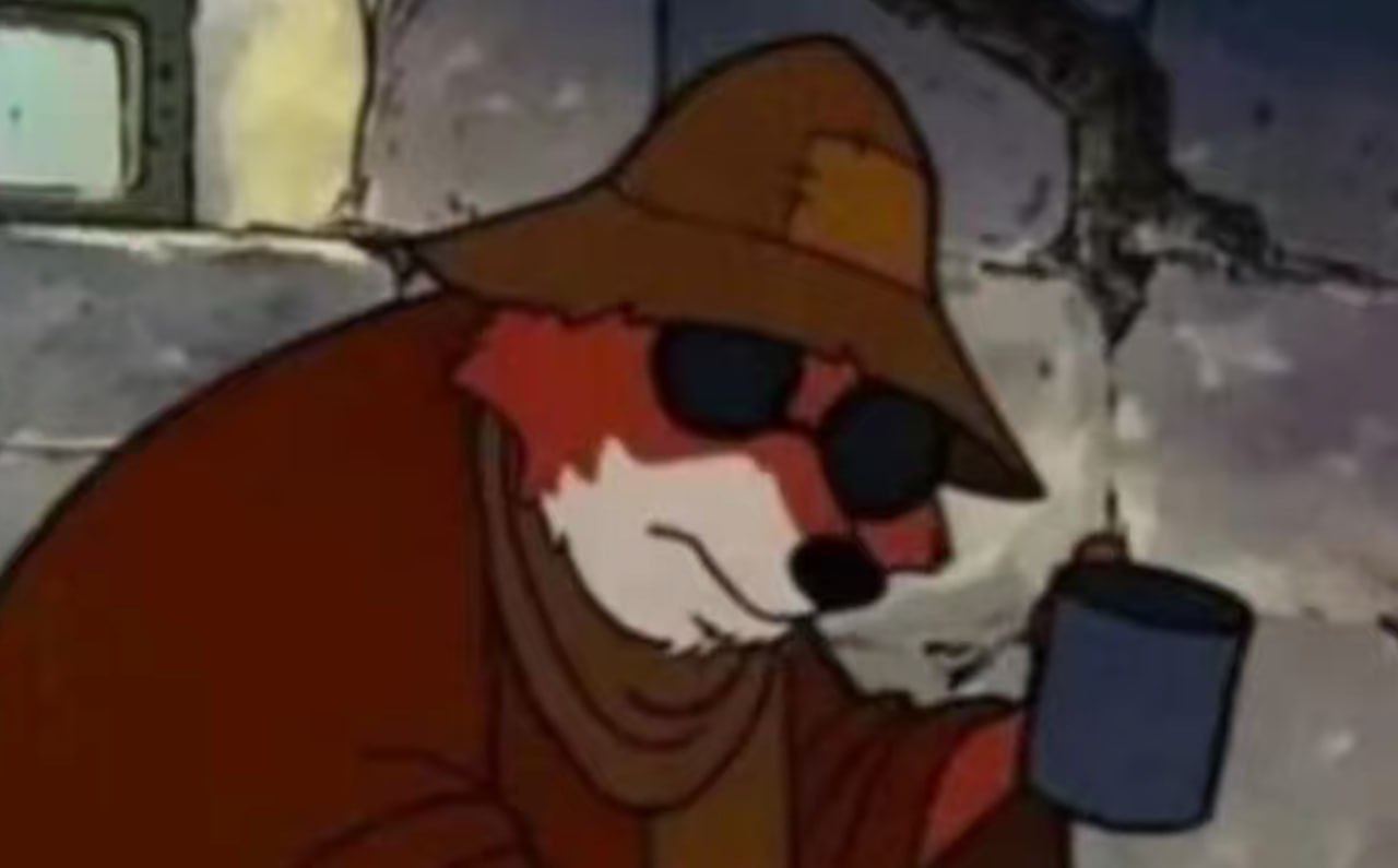 Cool fox drinking coffee